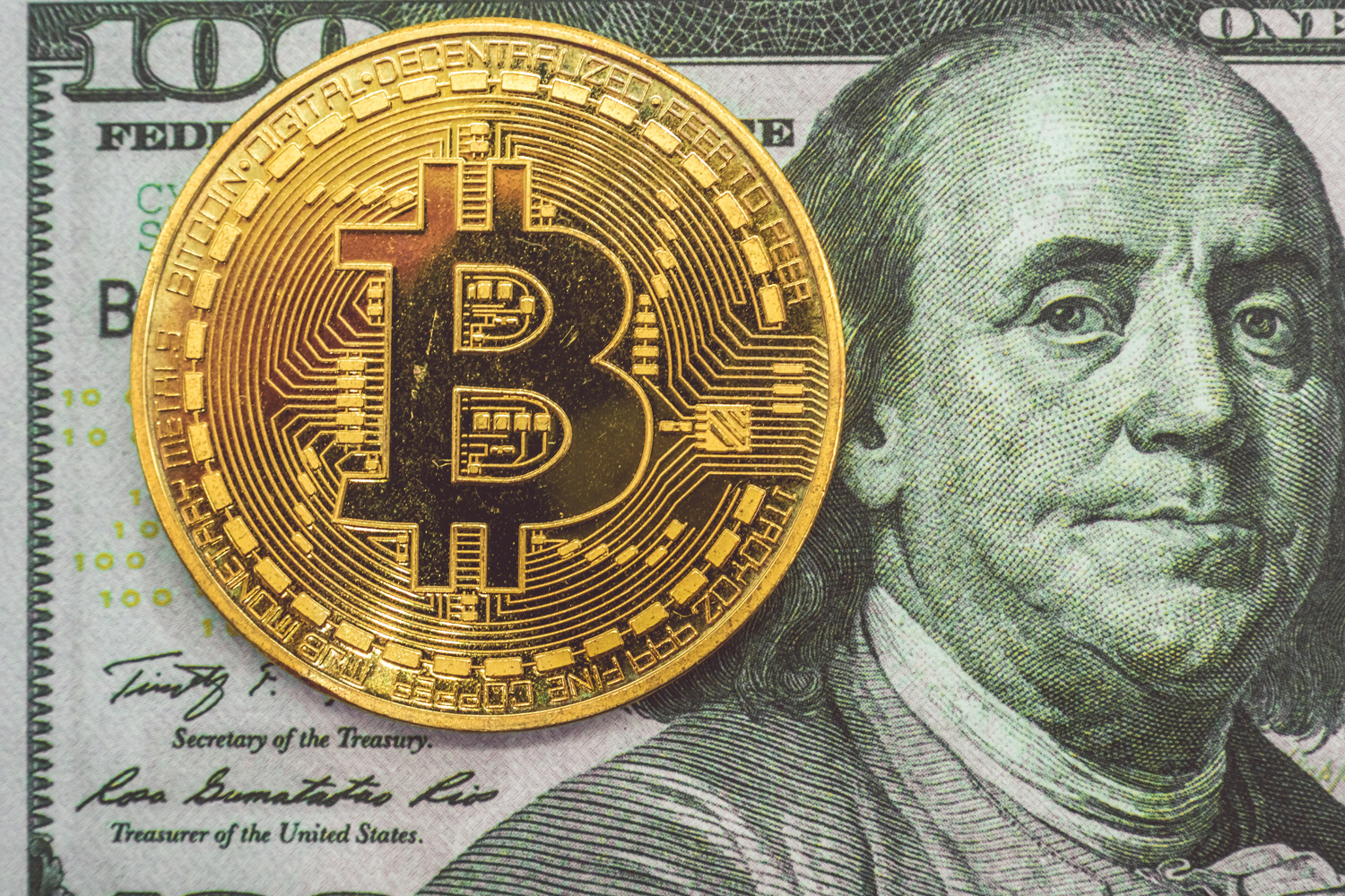 bitcoin on a hundred dollar bill