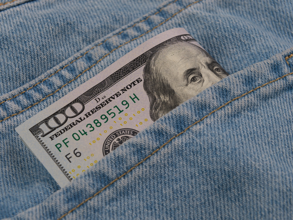 hundred dollar bill in jeans pocket