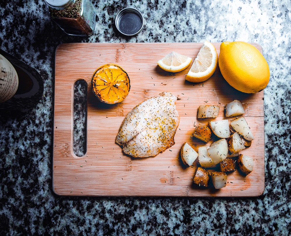 lemon butter fish on chopping board